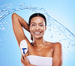 Shower, water and underarm shaving with a model black woman in studio on a blue background for hygiene or hydration. Relax, luxury and splash with a female inside to shave her armpit for hair removal