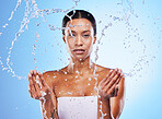 Facial leaning, water splash and skincare wellness, shower and black woman, hygiene and clean in blur studio background. Bathroom, beauty and cleanliness with a model washing her skin for fresh care