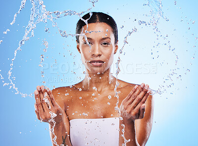 Facial leaning, water splash and skincare wellness, shower and black woman,  hygiene and clean in blur studio background. Bathroom, beauty and  cleanliness with a model washing her skin for fresh care |