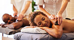 Spa, wellness and massage for couple and hot stone therapy, massage therapist hands for stress relief and body health. Man and woman relax with luxury service at beauty salon, peace and detox release