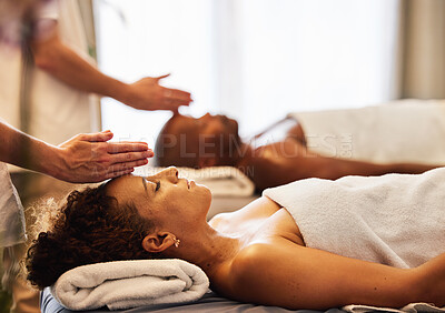 Buy stock photo Black couple, head massage and luxury spa to relax in a room for health, wellness and physical therapy. Man and woman on table for skincare, body care and hospitality while on a vacation