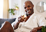 Champagne, spa and black man portrait toast to skincare, self care and wellness at a luxury resort. Happy, zen and smile of a man customer with a wine glass and alcohol ready or a massage or facial