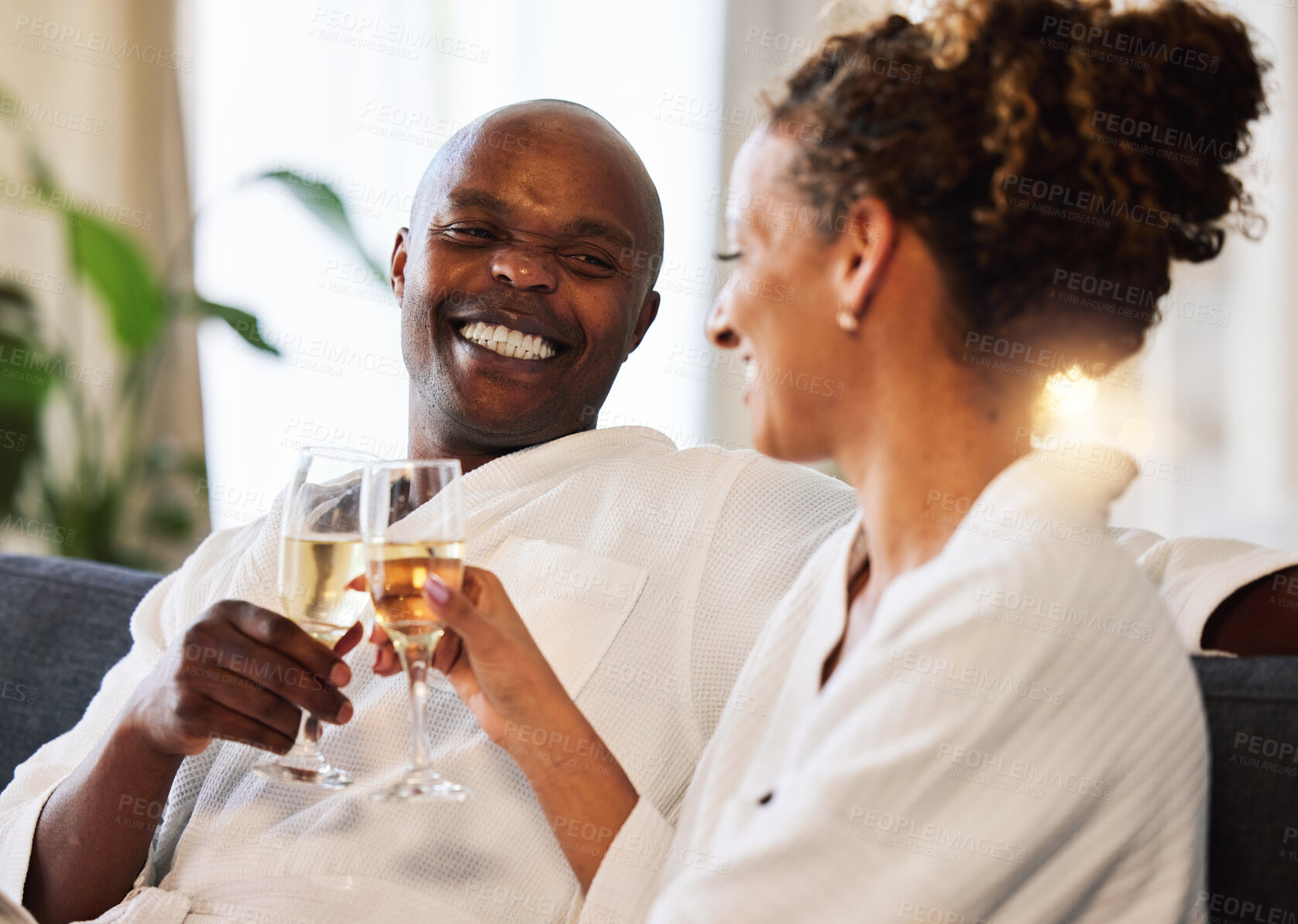 Buy stock photo Spa, relax and couple champagne toast for happiness with marriage, love and care at luxury hotel. Wellness, happy and black people smile together for wedding anniversary celebration drinks. 