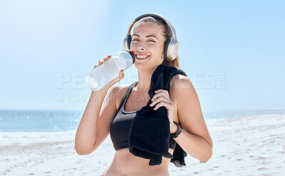 Buy stock photo Beach, workout woman drink water portrait with music by the sea with happiness after exercise. Morning run of an athlete by the ocean with a smile after running training and relax drinking water