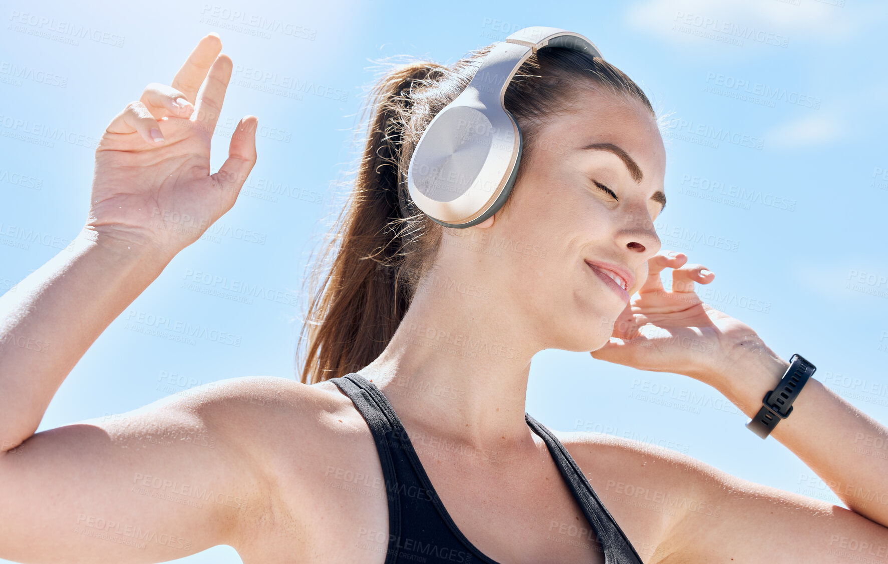 Buy stock photo Music, summer and dance with a woman outdoor in nature against a blue sky for dancing or freedom. Radio, relax and carefree with an attractive young female streaming or listening to audio outside