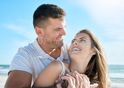 Buy stock photo Love, couple and hug with face, beach and happy with smile for relationship, romantic date or vacation together. Romance, man and woman look at each other, happiness and embrace for travel or holiday