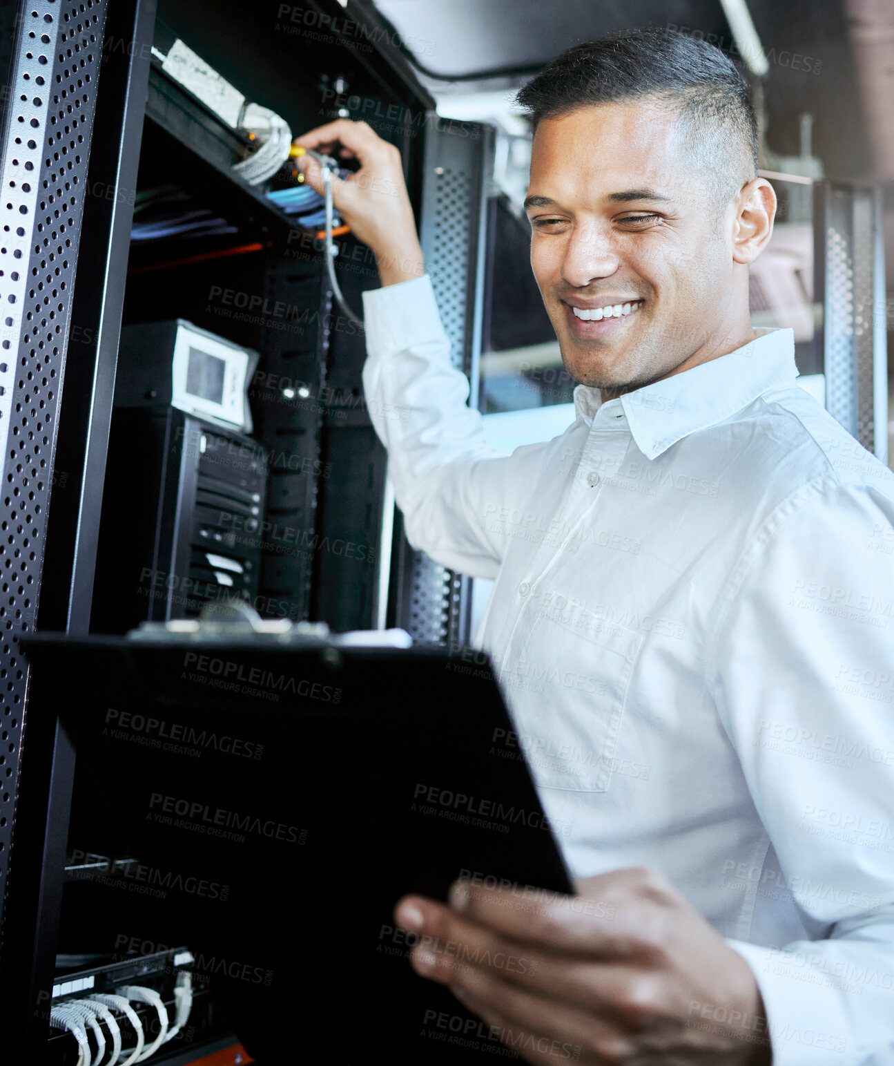 Buy stock photo Server room, IT support and database with a man programmer working on a mainframe in a data center. Software, cyber security and innovation with a male coder at work on a cloud for host networking