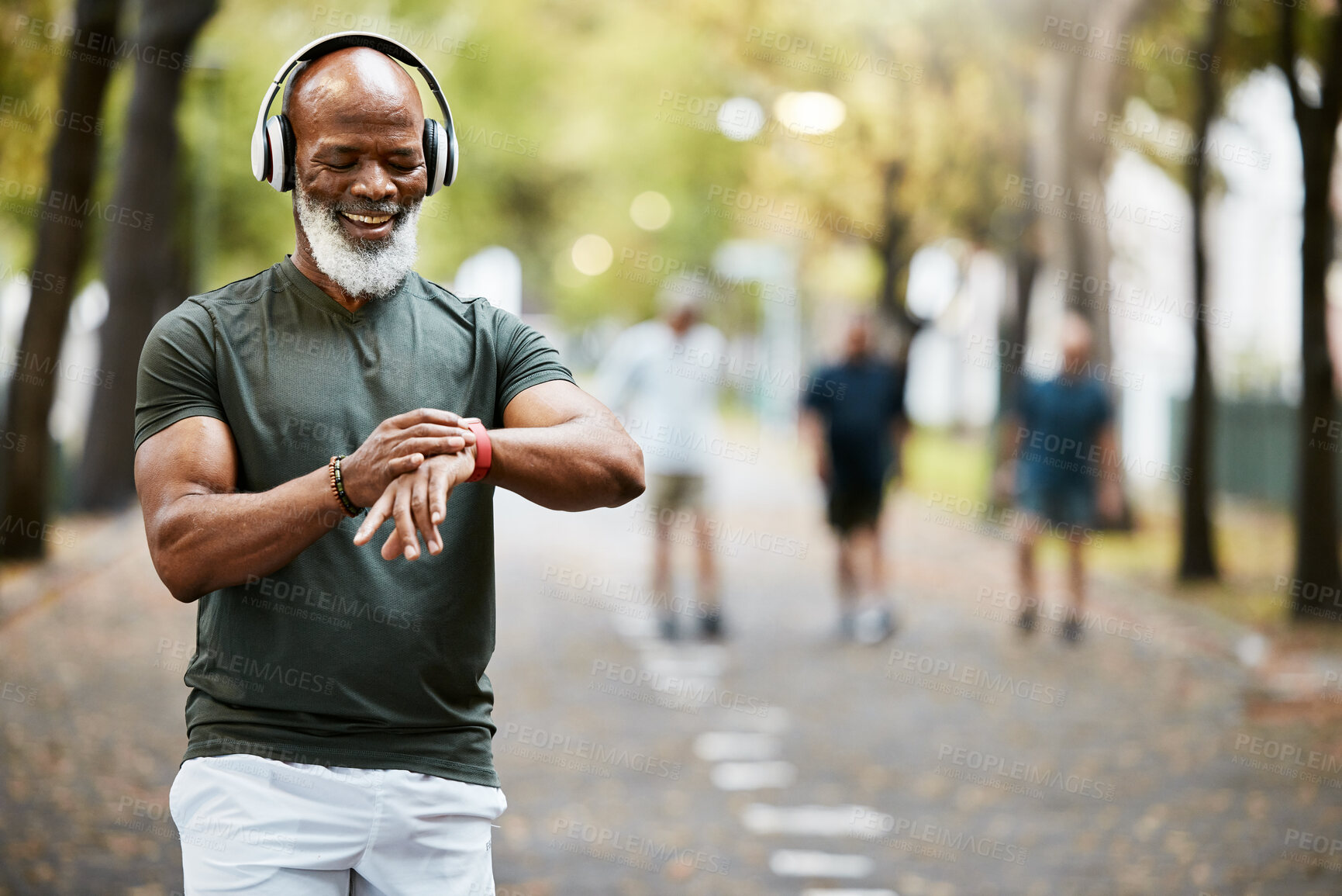 Buy stock photo Music, time and running with a mature black man looking at his watch while out for a fitness run in the park. Workout, wellness and training with a senior male athlete or runner tracking his health