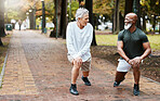 Fitness, friends and exercise with senior men stretching for a warm up at an outdoor park for health and wellness during retirement. Old man and cardio partner together for a workout while talking