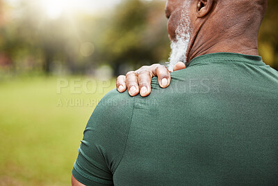 Buy stock photo Shoulder, pain and injury with a senior black man holding his joint, sore with inflammation outdoor during exercise. Fitness, workout and anatomy with a mature male athlete suffering from an accident