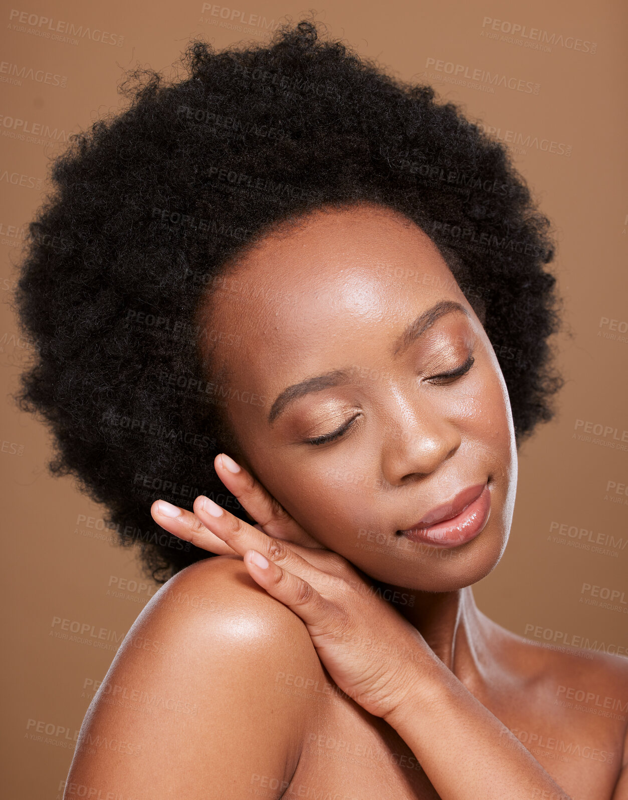 Buy stock photo Black woman afro, skincare and face with smile for cosmetics, beauty or makeup against a brown studio background. African American female relax in wellness for luxury facial, hair or skin treatment