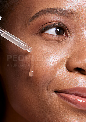 Buy stock photo Black woman, dropper and facial skincare cosmetics for beauty, hydration or oil treatment for healthy face. Closeup of African American female applying serum to cheek for skin hydrate, glow or shine