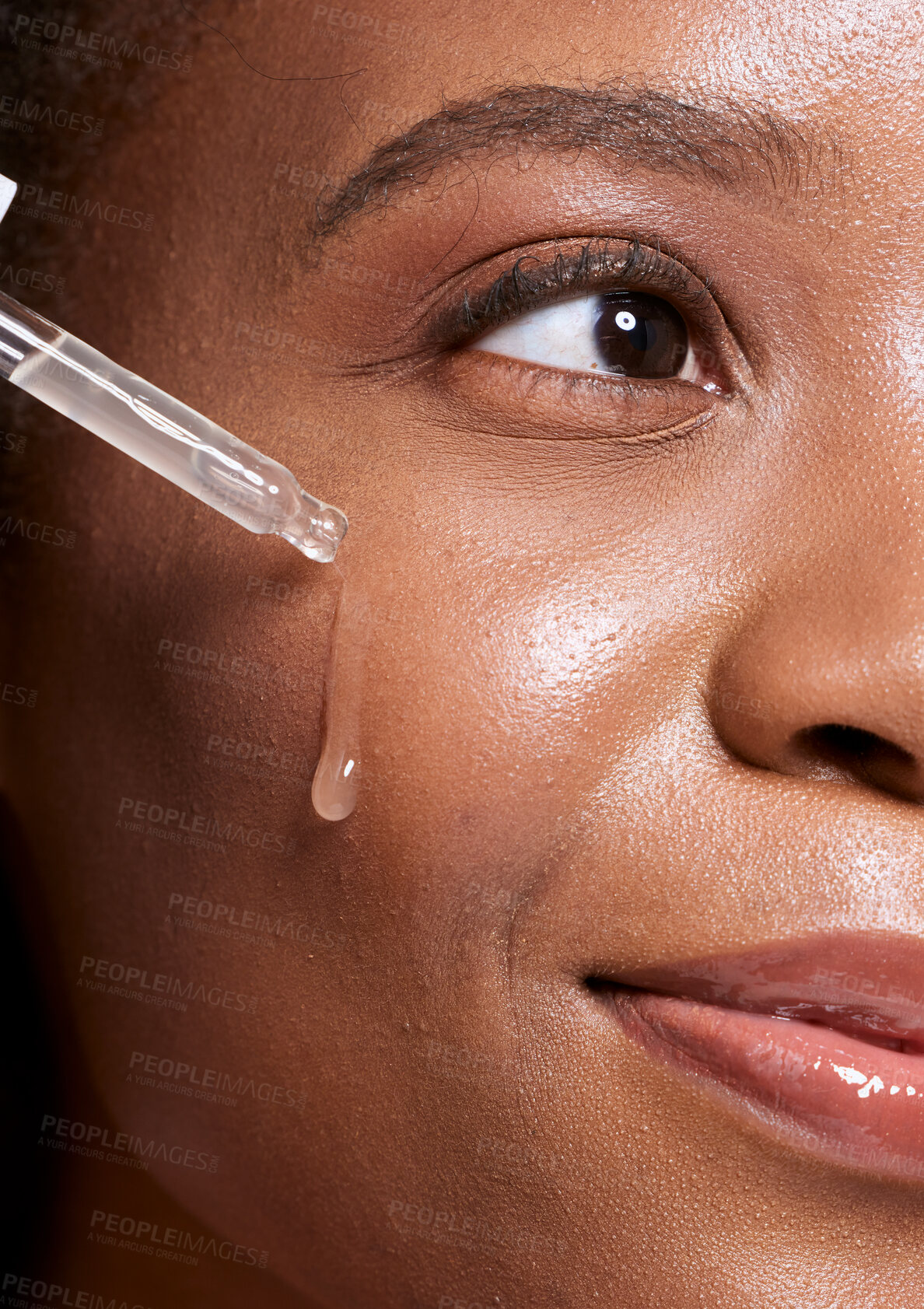 Buy stock photo Black woman, dropper and facial skincare cosmetics for beauty, hydration or oil treatment for healthy face. Closeup of African American female applying serum to cheek for skin hydrate, glow or shine