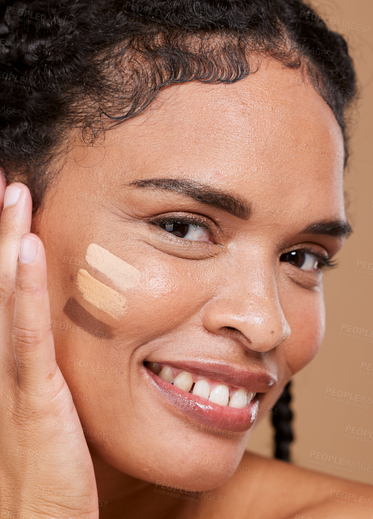 Buy stock photo Makeup, black woman and face with tone cream lines, skincare and smile on brown studio background. Cosmetics, African American girl and young female with healthy skin, contouring smears and portrait