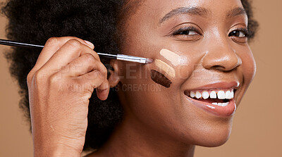 Buy stock photo Black woman, face and smile for makeup foundation, cosmetics or skincare against a brown studio background. Portrait of happy African female applying cosmetic beauty product with brush for skin toner