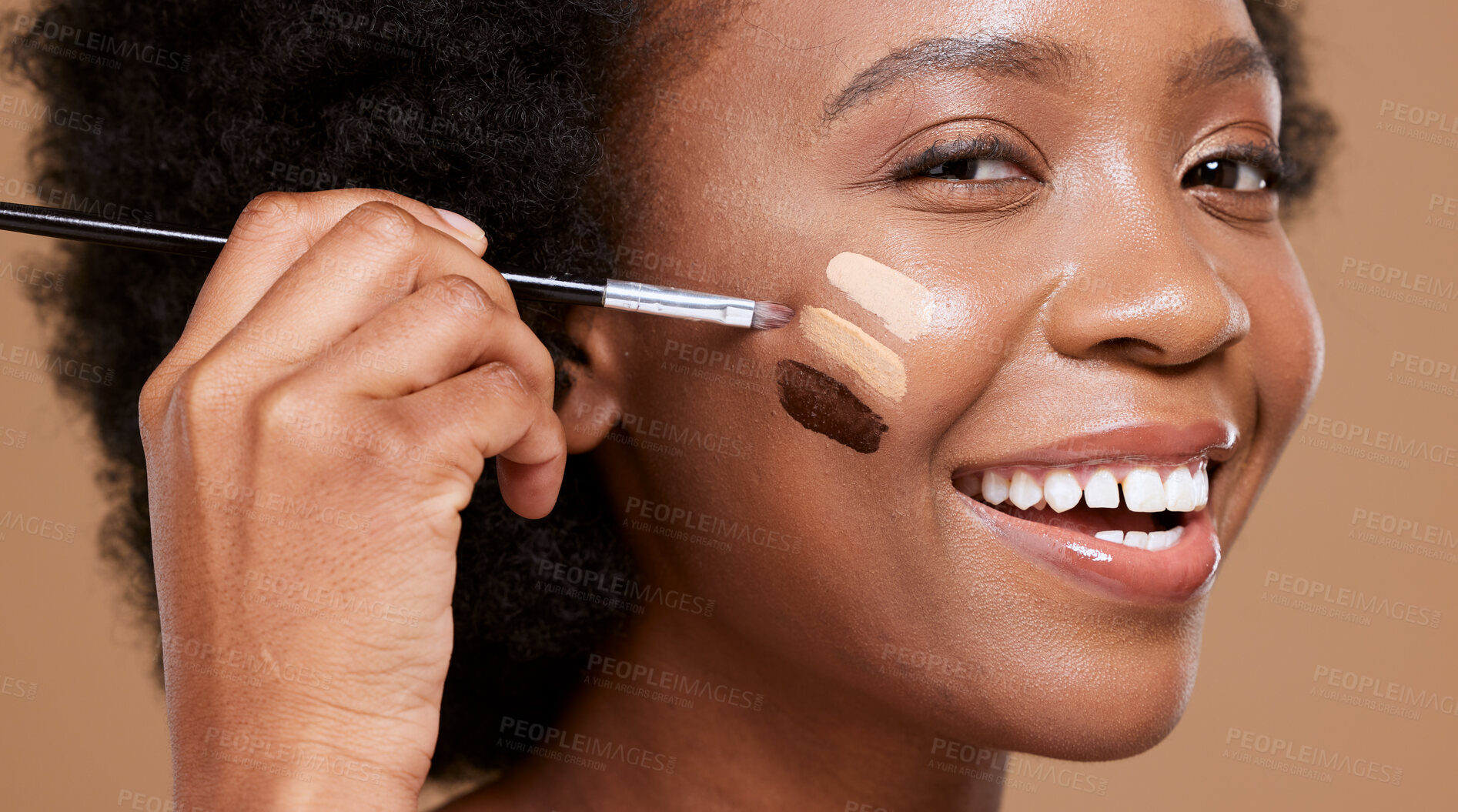 Buy stock photo Black woman, face and smile for makeup foundation, cosmetics or skincare against a brown studio background. Portrait of happy African female applying cosmetic beauty product with brush for skin toner