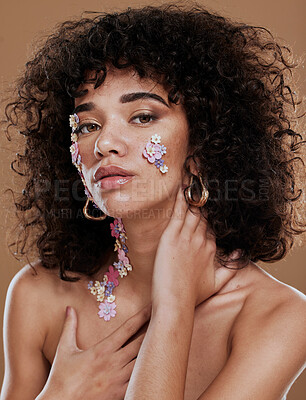 Buy stock photo Makeup, model and flower eye makeup for beauty, wellness and skincare on face in studio portrait. Black woman, creative flowers and glow skin with cosmetics, health and floral pattern for body art
