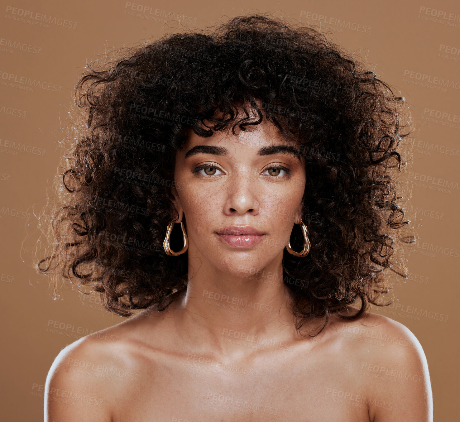 Buy stock photo Portrait, skincare and black woman in studio for hair, skin and beauty, grooming and hygiene on brown background. Face, wellness and girl model with natural, afro and glam cosmetic with makeup