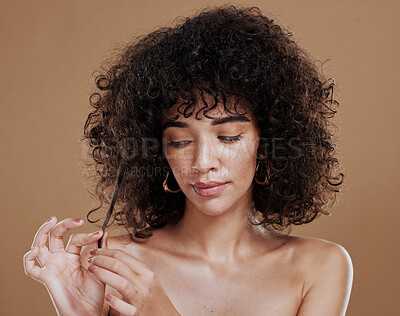 Buy stock photo Beauty, skincare and hair care of black woman in studio with natural makeup, cosmetics and dermatology on brown background. Aesthetic model with curly hair and growth shampoo for health and wellness
