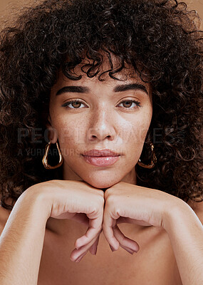 Buy stock photo Portrait, skincare and beauty with a model black woman in studio on a brown background for natural care. Makeup, hair and wellness with an attractive young afro female posing for haircare treatment