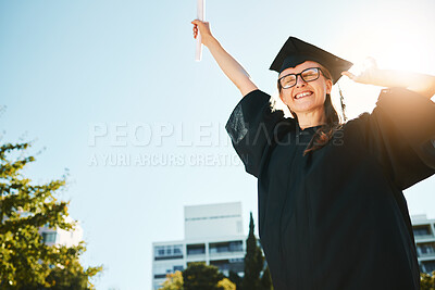 Buy stock photo Woman, student and graduate for university achievement, scholarship or success for grades at the campus. Happy female in celebration for graduation, certificate or diploma for academic qualifications