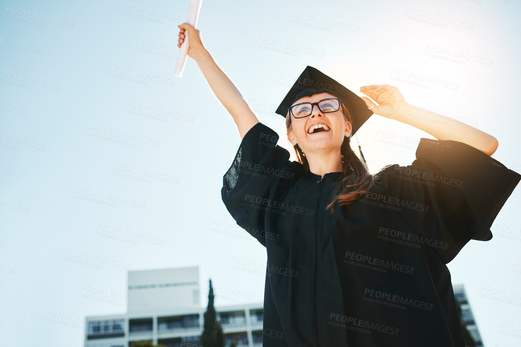 Buy stock photo Success, graduation and woman or student with certificate, degree or diploma low angle. Graduate, celebration and female scholar happy with academic achievement, university goals or education targets