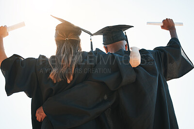 Buy stock photo Graduation, education and goal with a man and woman university or college graduate in celebration together. Celebration, back and certificate with a male and female pupil cheering their achievement