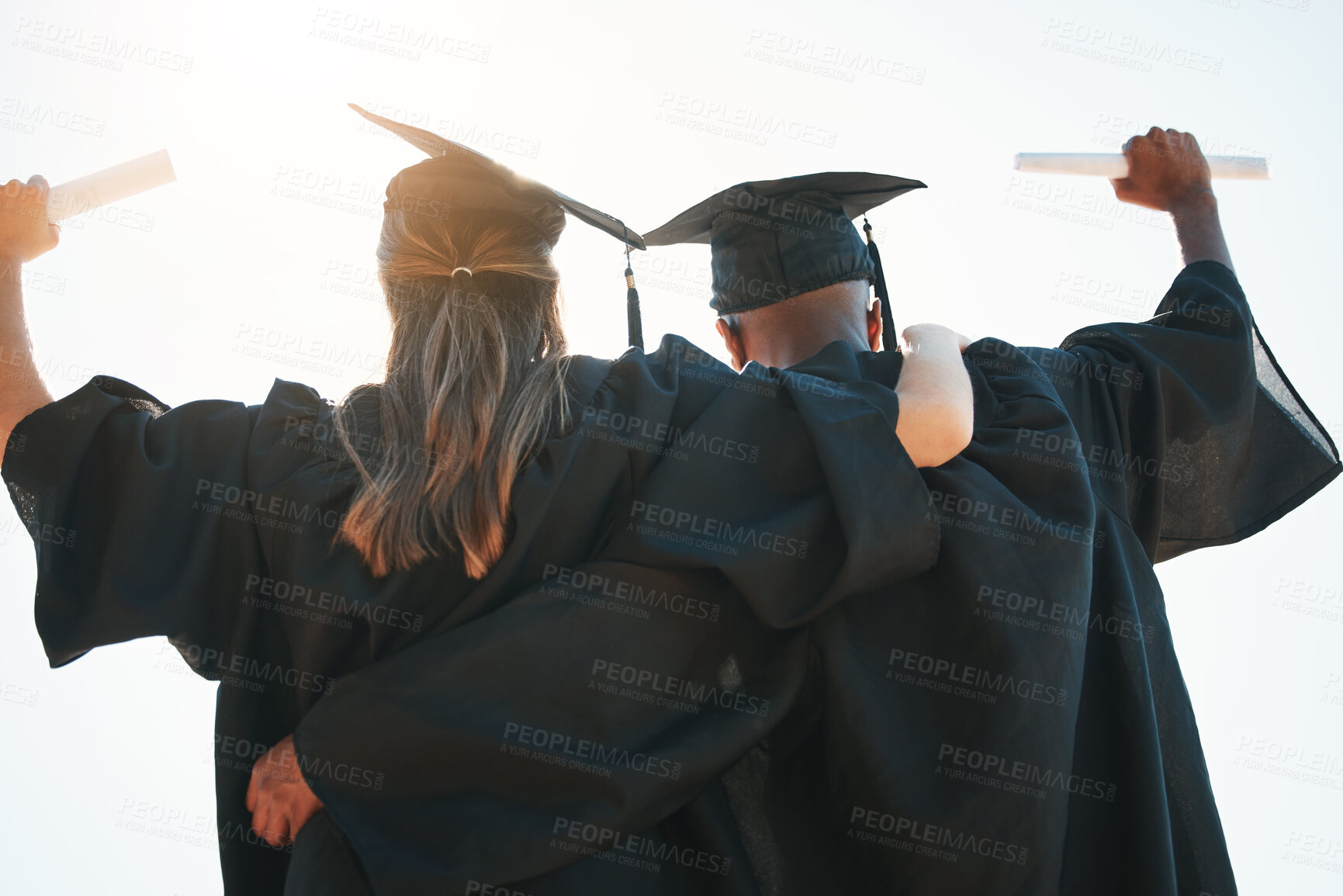 Buy stock photo Graduation, education and goal with a man and woman university or college graduate in celebration together. Celebration, back and certificate with a male and female pupil cheering their achievement