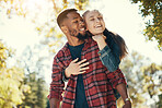 Love, woman and hug man from behind, happy and loving together in nature, quality time and romance. Romantic, couple and embrace for relationship, interracial and happiness outdoor, dating and smile.