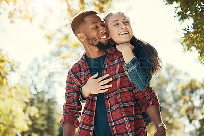 Buy stock photo Love, woman and hug man from behind, happy and loving together in nature, quality time and romance. Romantic, couple and embrace for relationship, interracial and happiness outdoor, dating and smile.