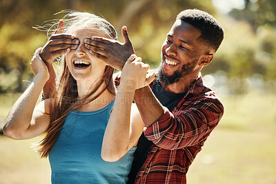 Buy stock photo Diverse, couple and man and surprise woman by covering her eyes in a nature park. Shock, wow and people having fun for anniversary surprise in a natural evironment with boyfriend and girlfriend 