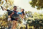 Young interracial couple, park and man carrying woman on summer date in garden, sunshine fun or relax, love and care together. Happy couple, smile and diversity people in nature for relationship play