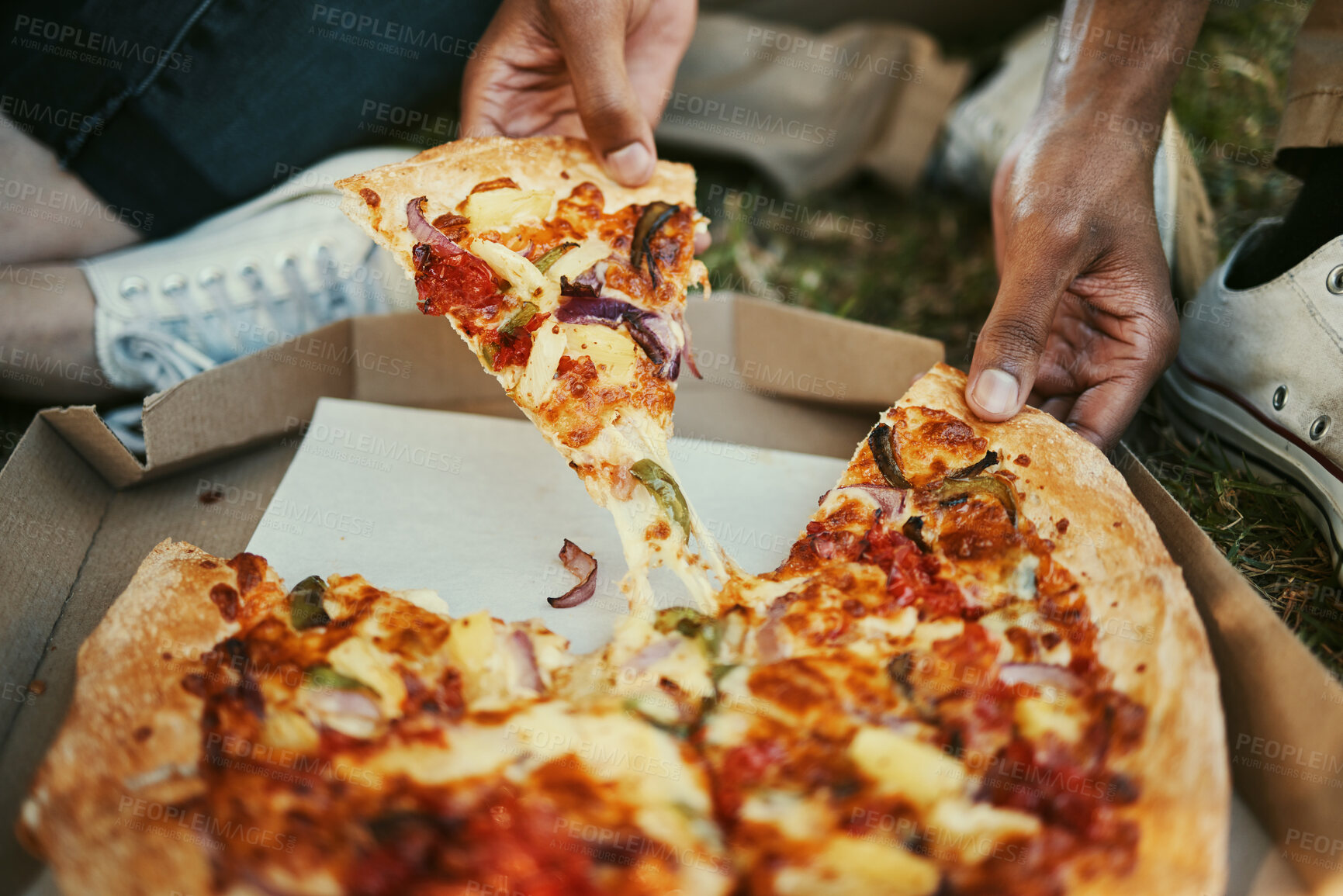 Buy stock photo Pizza, food and hands of a couple eating in a park, picnic and relax on an outdoor date together. Hungry, fast food and zoom of man and woman with lunch or dinner in nature for peace and calm