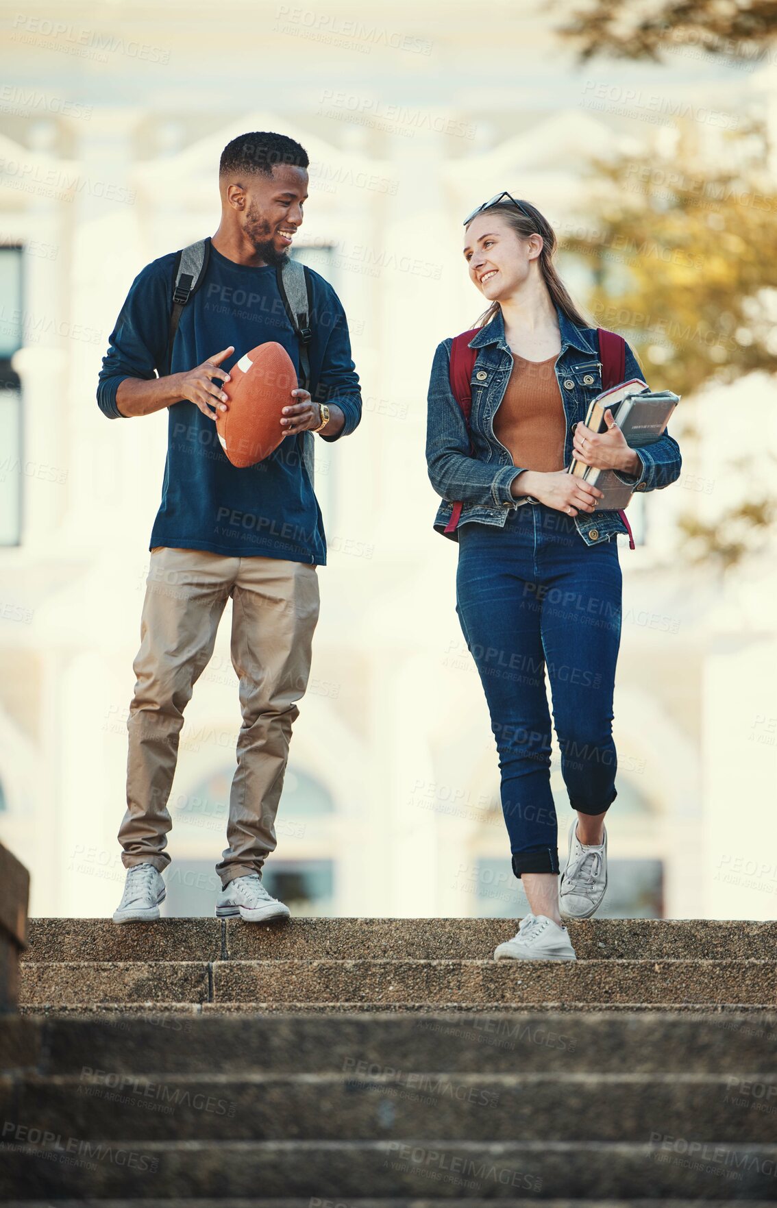 Buy stock photo Friends, education and walking with diversity students on college or university campus together. Study, school and books with a man and woman pupil talking or bonding during their walk to class