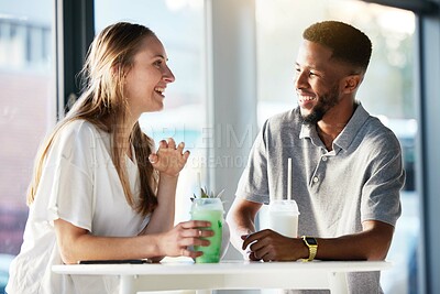 Buy stock photo Couple, drink and happy with talking, date and enjoy in shop, cafe or store with smile, happy and romance. Interracial man, woman or friends in funny conversation, communication and bonding together