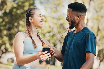 Buy stock photo Music, fitness and running with a diversity couple outdoor in park for exercise or training together. Fitness, phone and workout with a sports man and woman outside listening to runner motivation