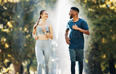 Buy stock photo Diversity, running and couple wellness conversation in park for training exercise and sports marathon motivation. Interracial runner athletes, cardio workout and healthy fitness together in forest