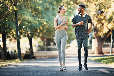 Buy stock photo Running, fitness and interracial couple in nature for cardio, exercise and marathon training. Workout, sports and young man and woman with motivation, love and health as a runner in park with energy