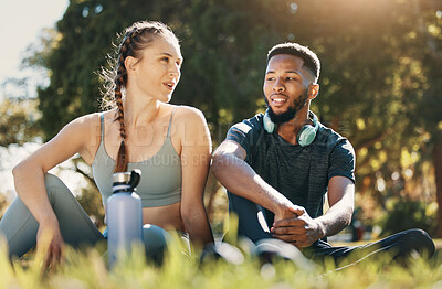 Buy stock photo Relax, man and woman on grass, for wellness and exercise for health, workout and rest together. Couple, black male and female talking, fitness and break in nature, outdoor and speaking after training