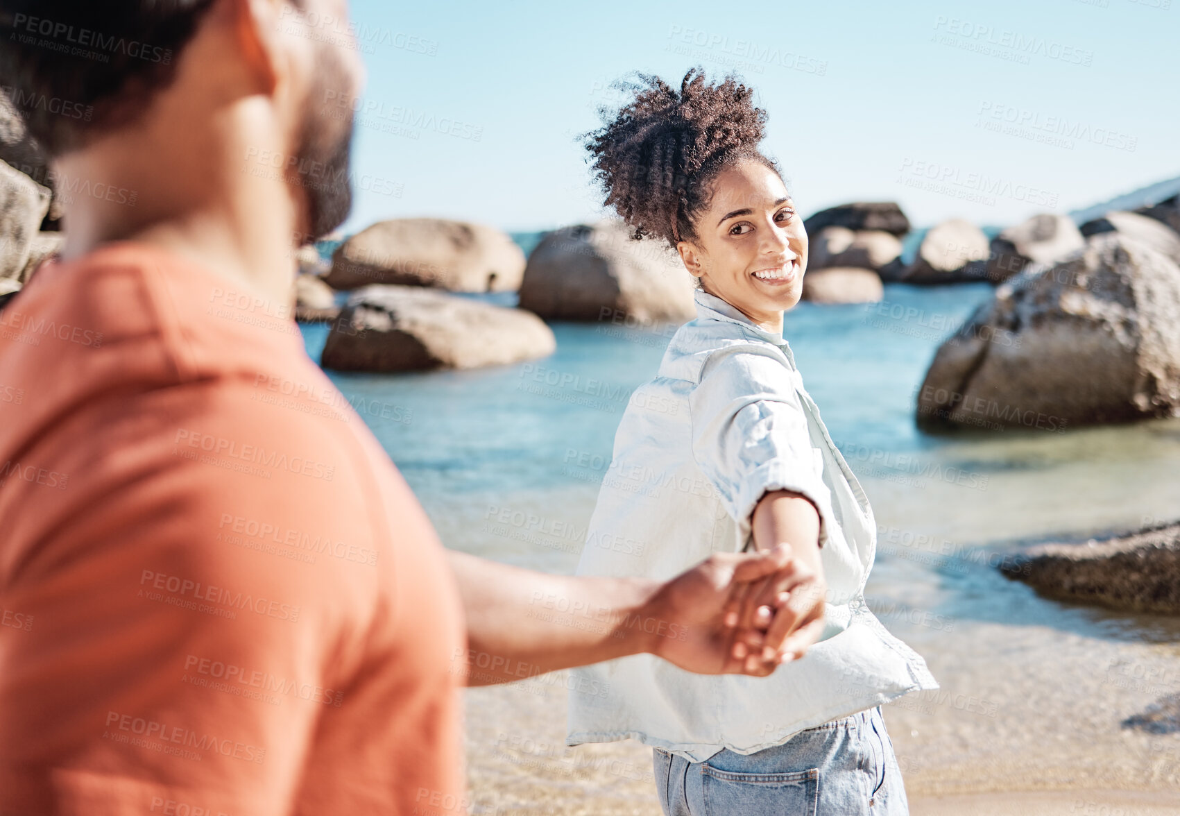 Buy stock photo Black couple, holding hands and beach vacation with wife leading partner to follow into water for adventure, fun and travel. Man and woman on summer, holiday by sea for love, support and quality time