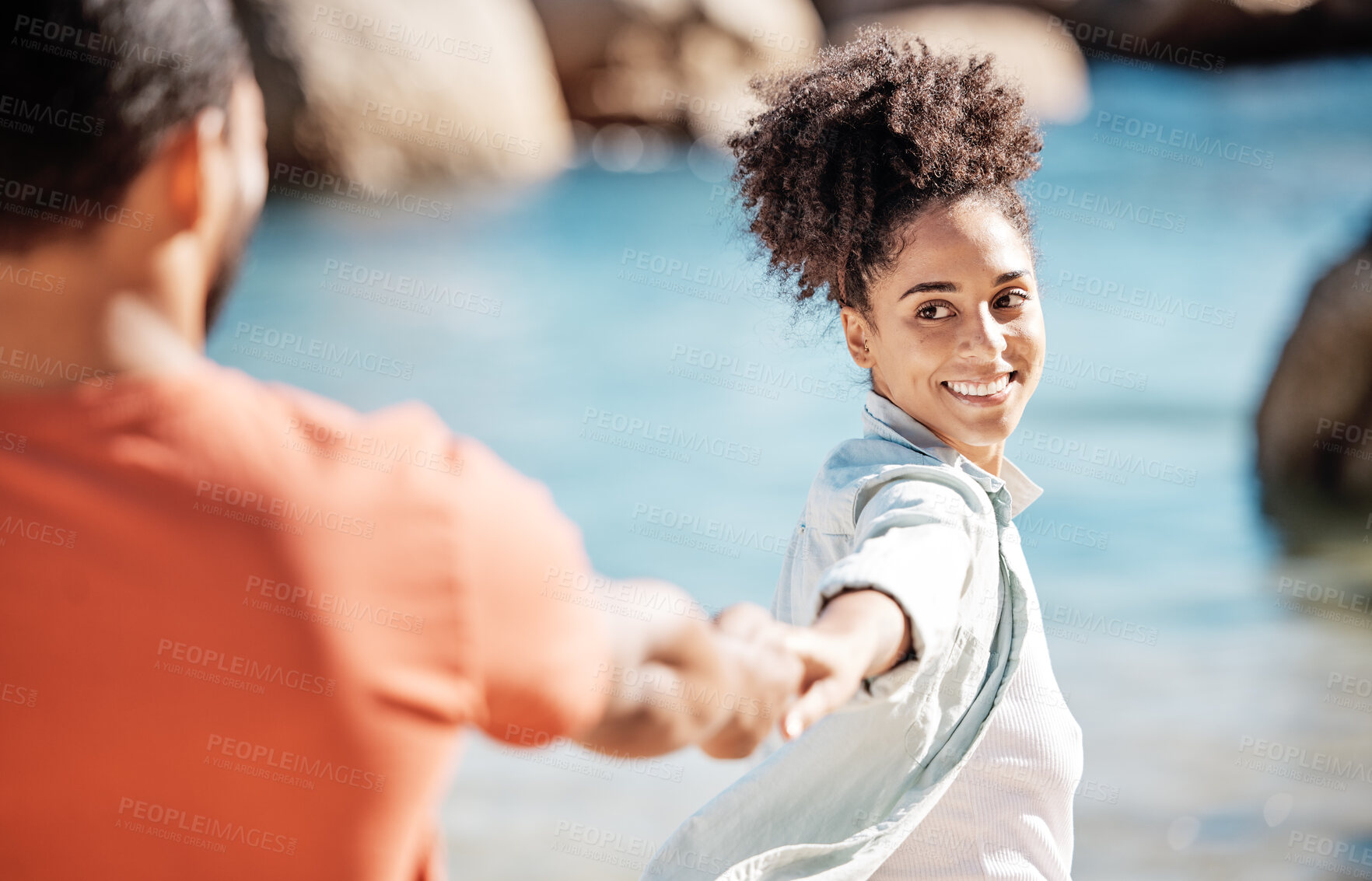 Buy stock photo Black couple, beach and vacation while holding hands for love, adventure and travel together in nature with love, care and trust. Women leading man to follow into water while on holiday in summer