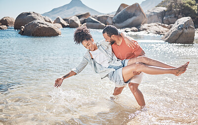 Buy stock photo Love, water and playful black couple at the beach enjoy summer vacation, holiday and weekend. Travel, nature and man carrying woman standing in ocean having fun, bond and spend quality time together