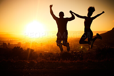 Buy stock photo Sunset silhouette, couple jumping and a nature hike adventure for winning fitness exercise, fun holiday and city view. Summer cardio, outdoor training and workout motivation for body health success 
