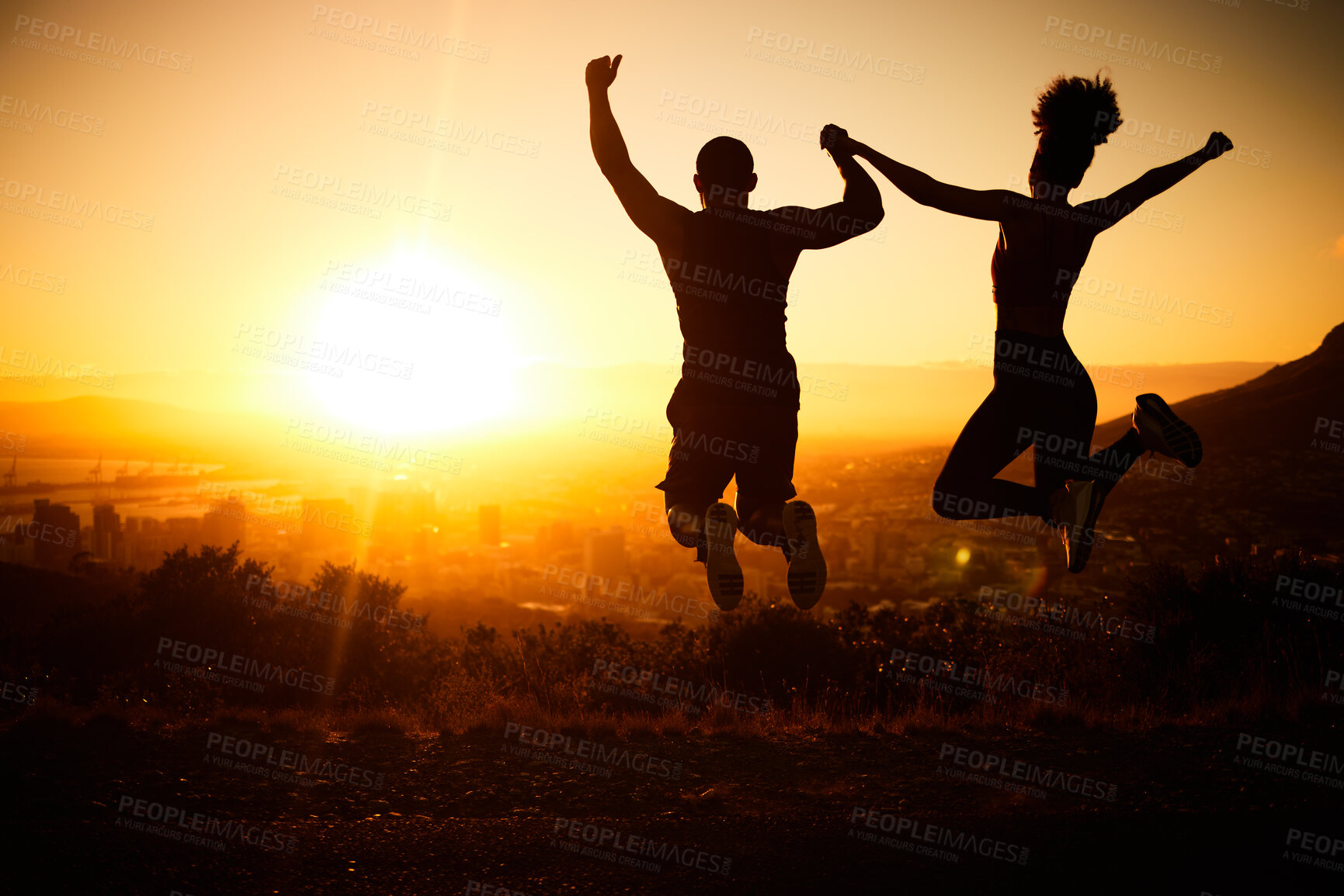 Buy stock photo Sunset silhouette, couple jumping and a nature hike adventure for winning fitness exercise, fun holiday and city view. Summer cardio, outdoor training and workout motivation for body health success 
