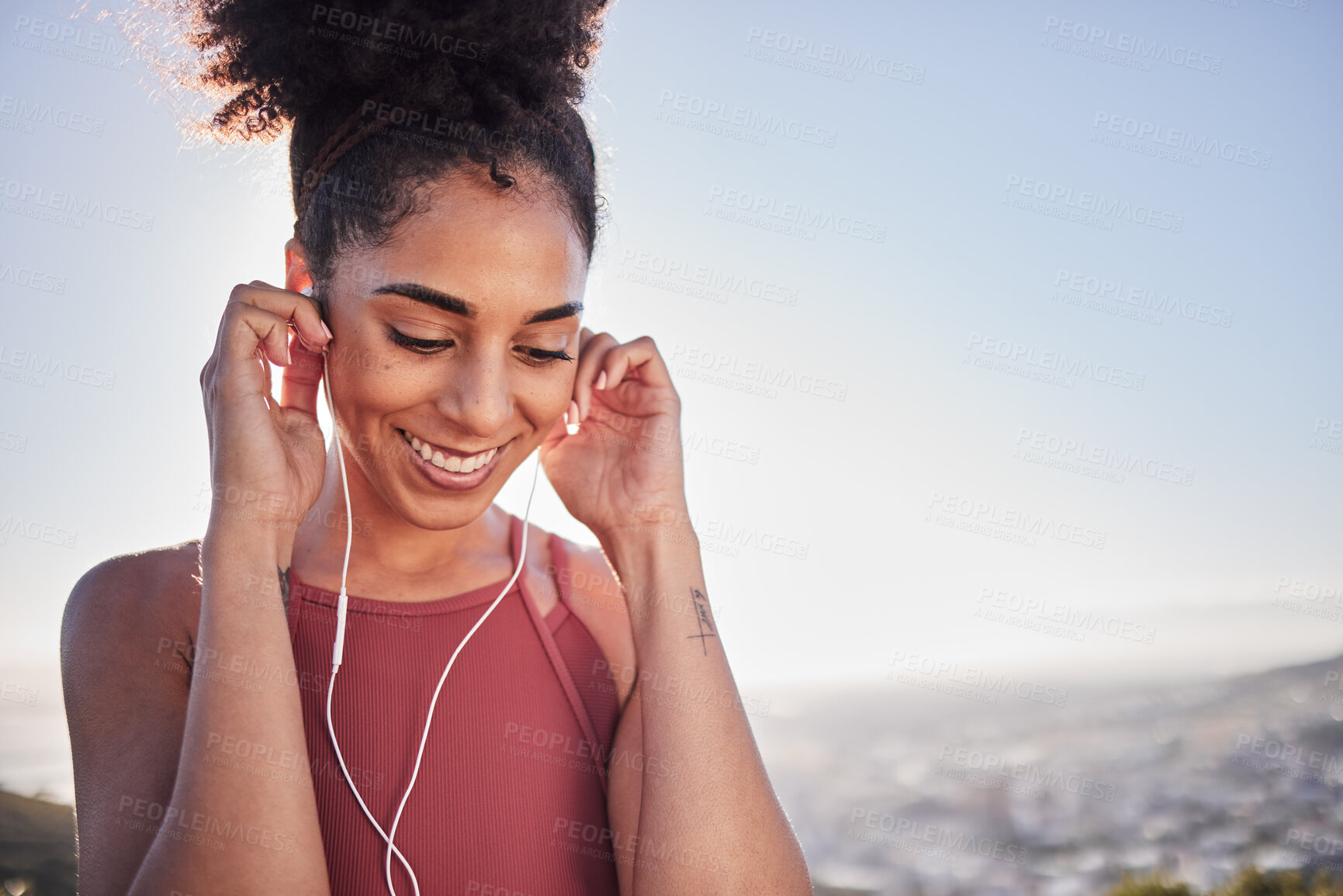 Buy stock photo Radio, workout and woman in city for running, exercise and fitness training while listening to wellness audio track. Podcast, runner and black woman workout at sunrise, happy and excited by music 