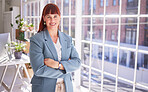 Business woman, portrait smile and arms crossed for vision, ambition or career success at the office. Happy female leader or manager smiling for successful corporate design or company startup at work