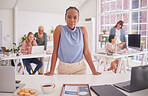 Meeting, office and portrait of an African woman in a modern office planning a corporate project. Professional, team and business people working together in a coworking space in the workplace.