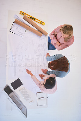 Buy stock photo Top view, teamwork and architects with blueprint in office for construction project from above. Meeting, architecture and development planning of contractors or engineers with building design sketch.