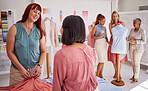 Creative startup, teamwork and fashion designer team together for planning, ideas and inspiration while talking fabric and textile. Tailor and manager in discussion about clothes project workshop