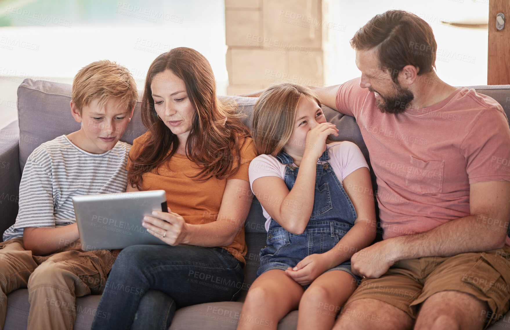 Buy stock photo Family, sofa and tablet with children and parents streaming an online subscription in home living room. Kids, internet and video with a man, woman and kids or siblings watching series in the lounge